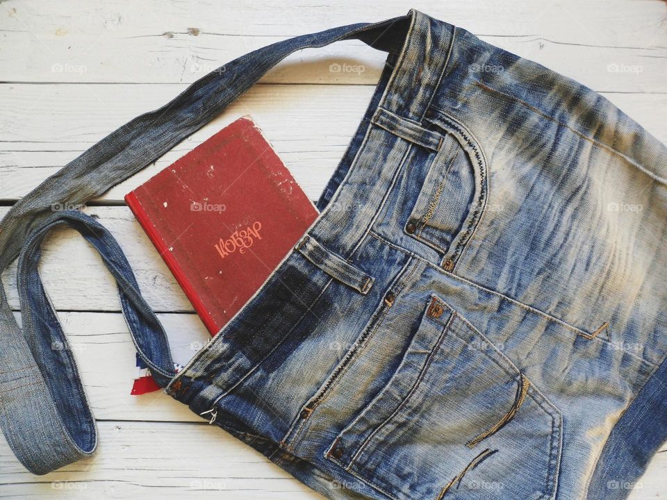 denim bag, a book on the table