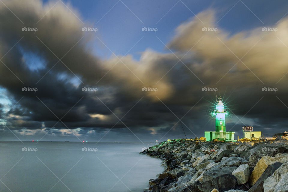 Storm clouds over the South Mole lighthouse at Fremantle, Western Australia