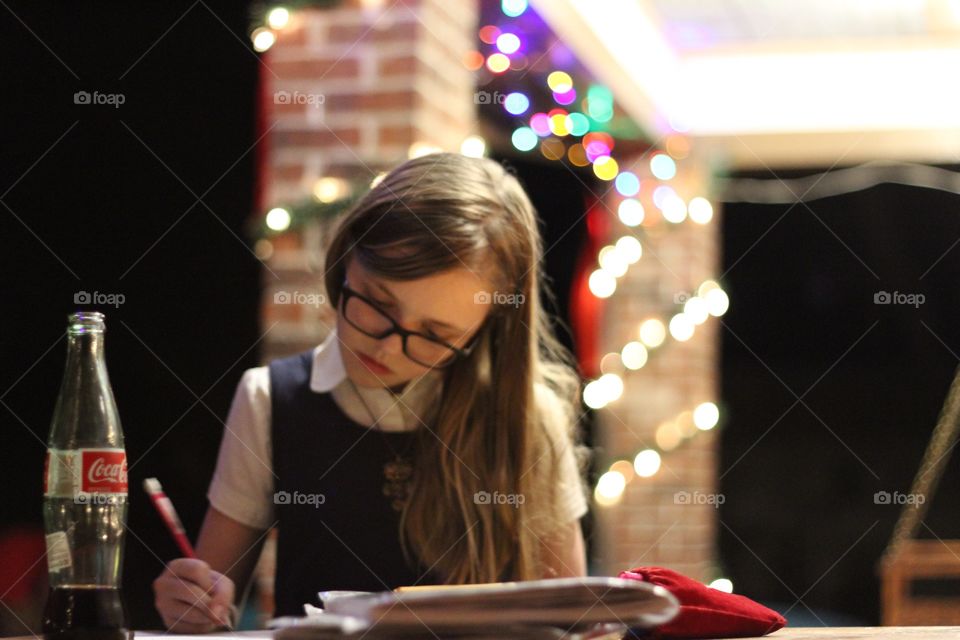 Student doing homework 
Christmas lights
Coke