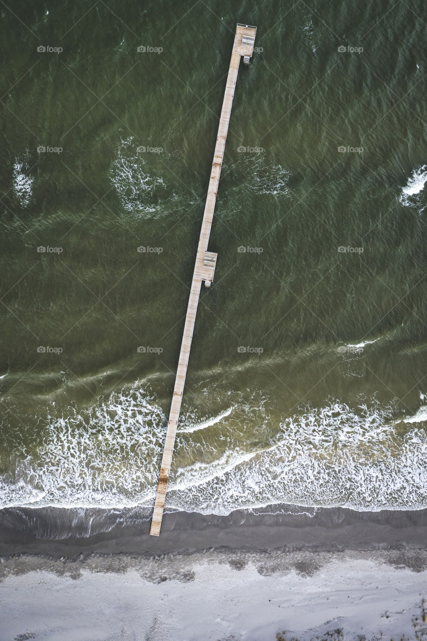 This is a droneshot from a bridge nearby my house. I love the ocean color and the waves.