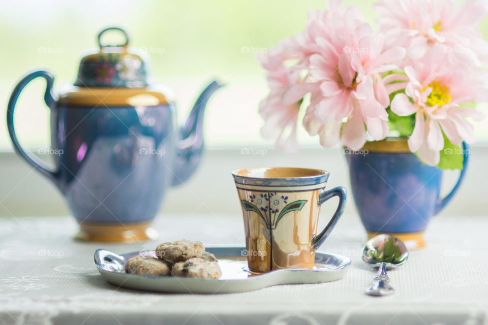 Tea cup with vase