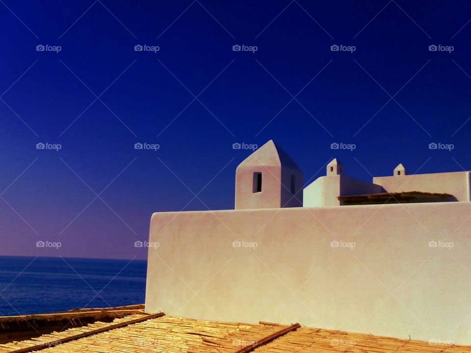 House of Stromboli Island ( Italy ) at Sunset.