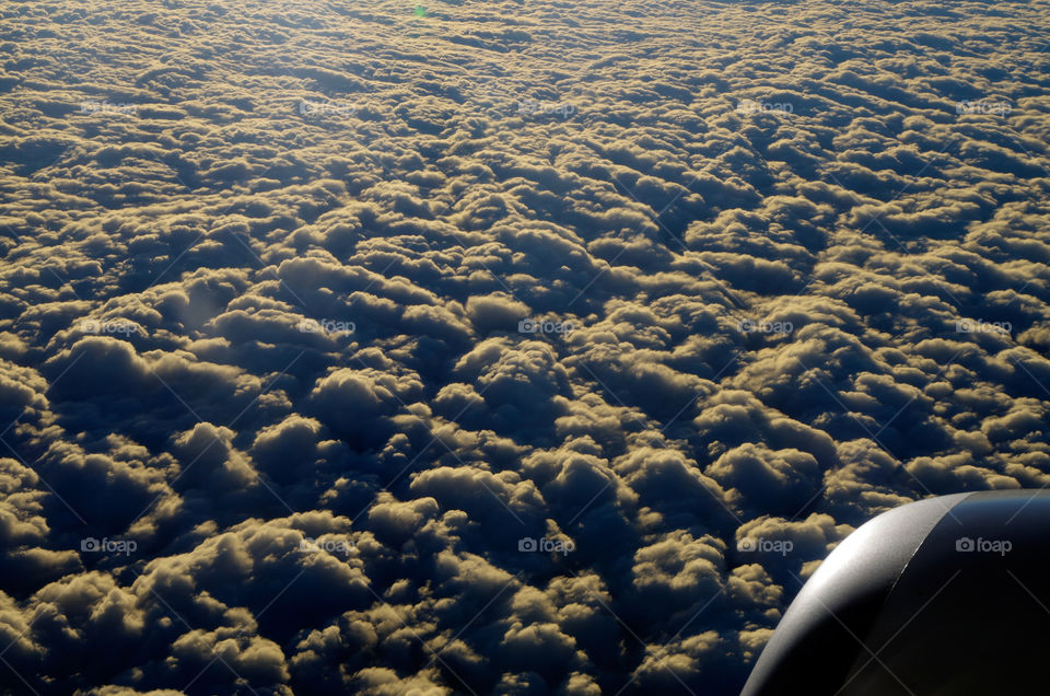 Aerial view of clouds from airplane.