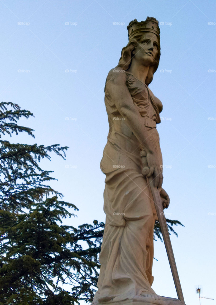 Statue of a woman with a sword.  Occhiobello.  Italy