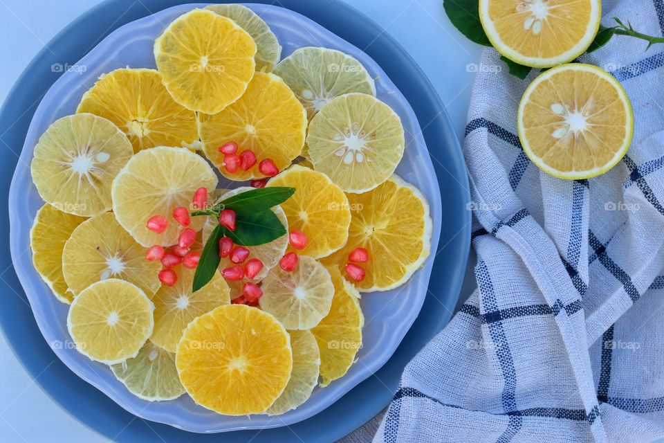 slices of oranges and lime on a plate