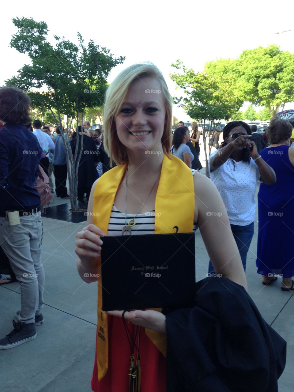 Girl showing her diploma