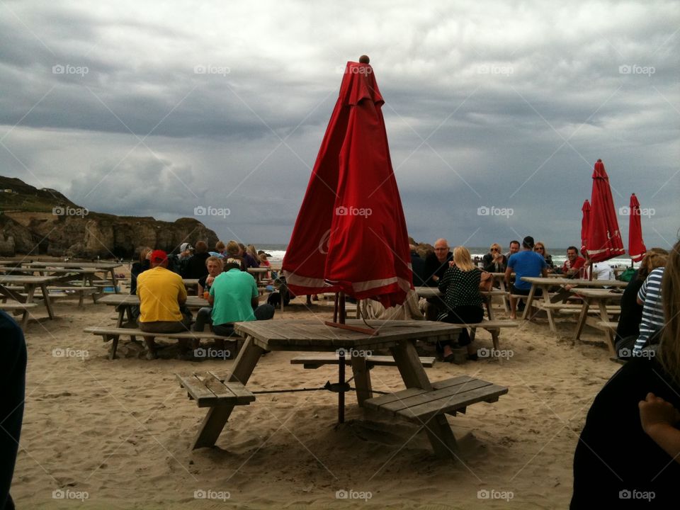 Nice day for a beach picnic? Looks more like the apocalypse is coming - umbrellas at the ready. 