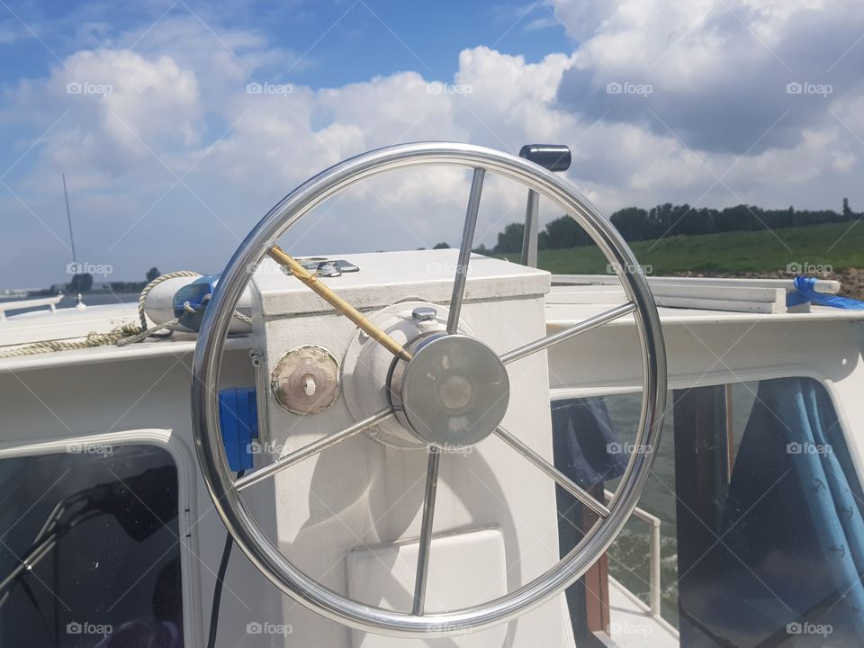 Round wheel-shaped object with which a vehicle (boat) can be driven. metal, drive outside.