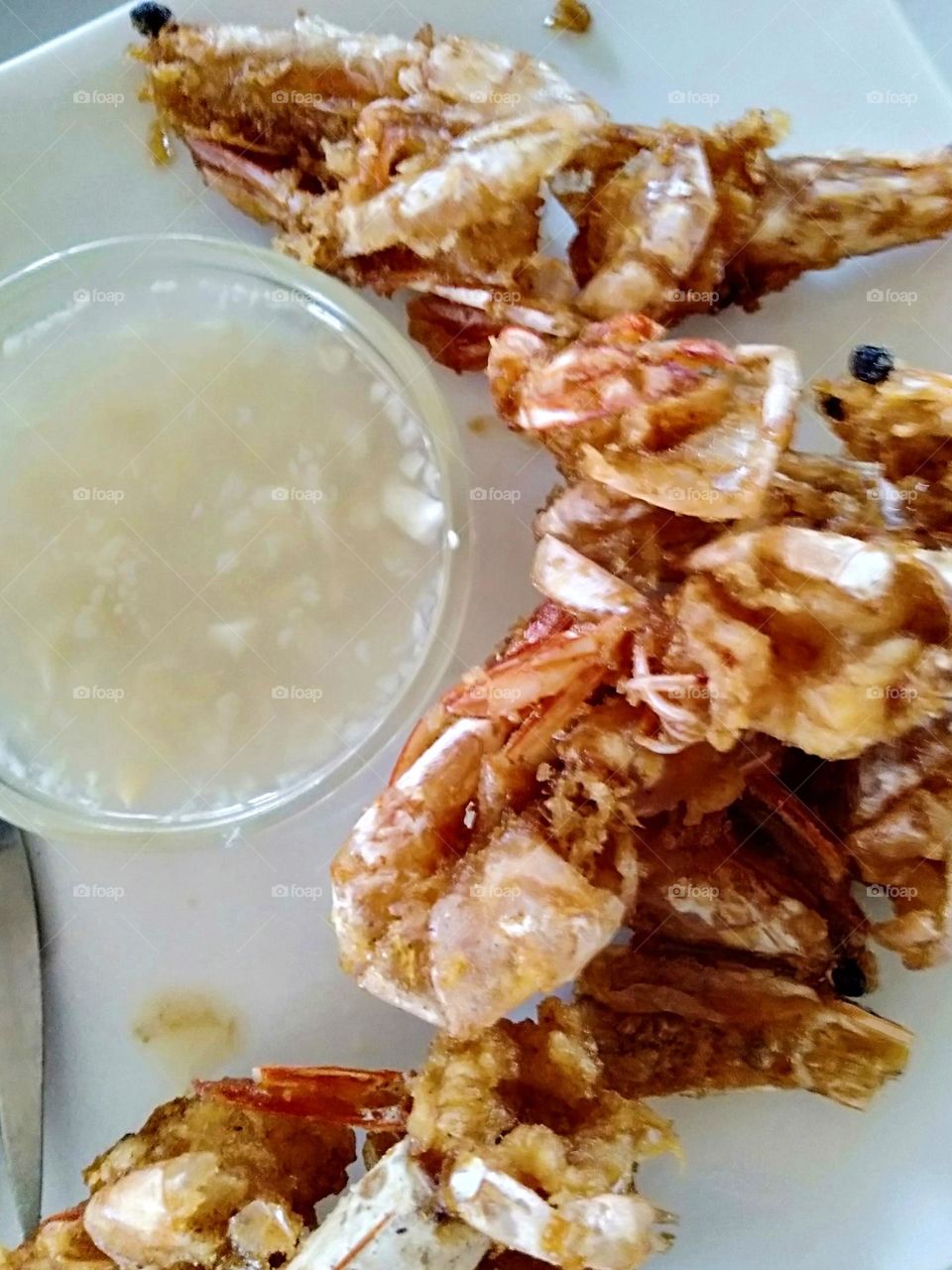 Garlic butter fried Shrimp with lemon.