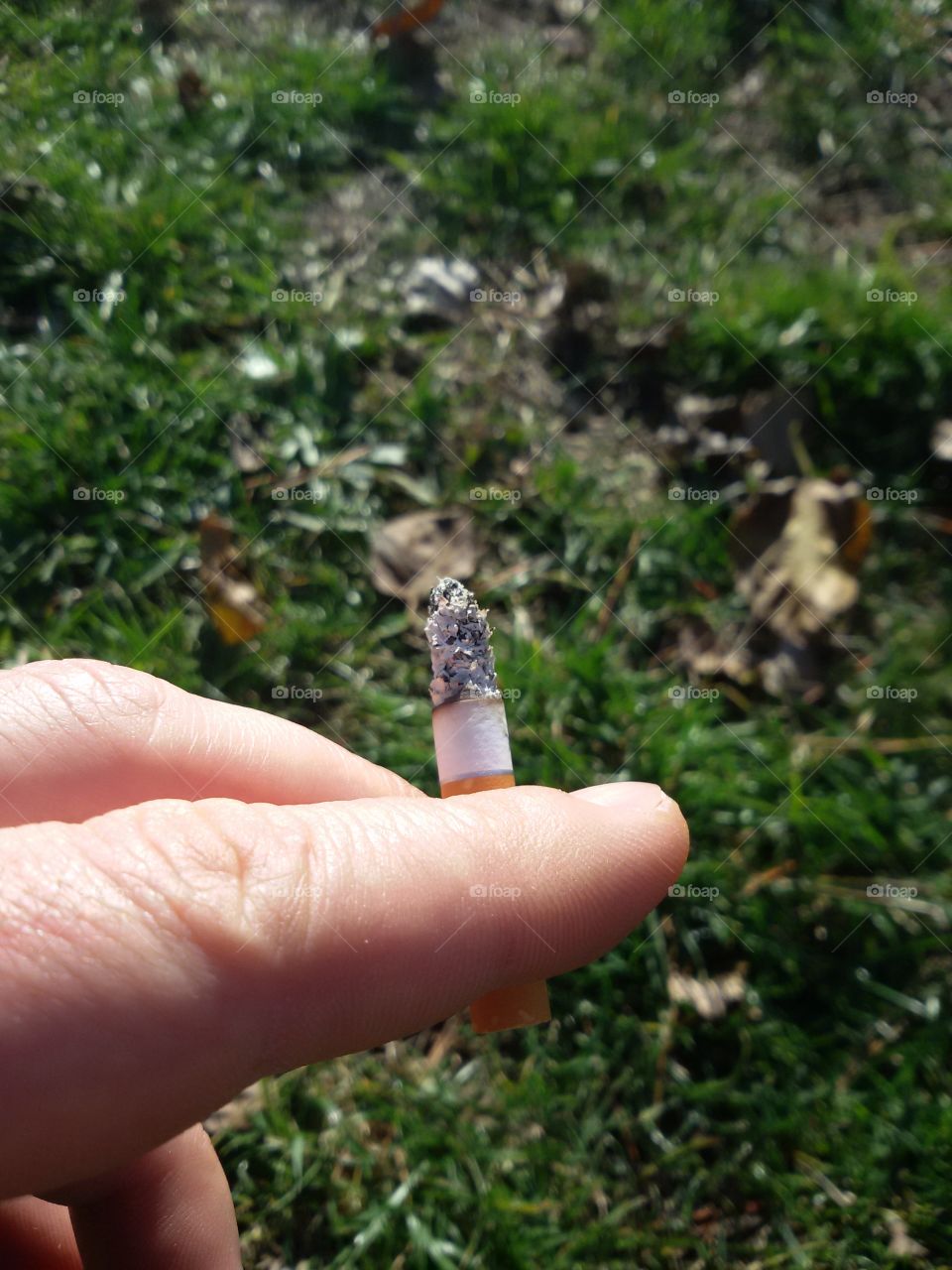 smoking outside in a park