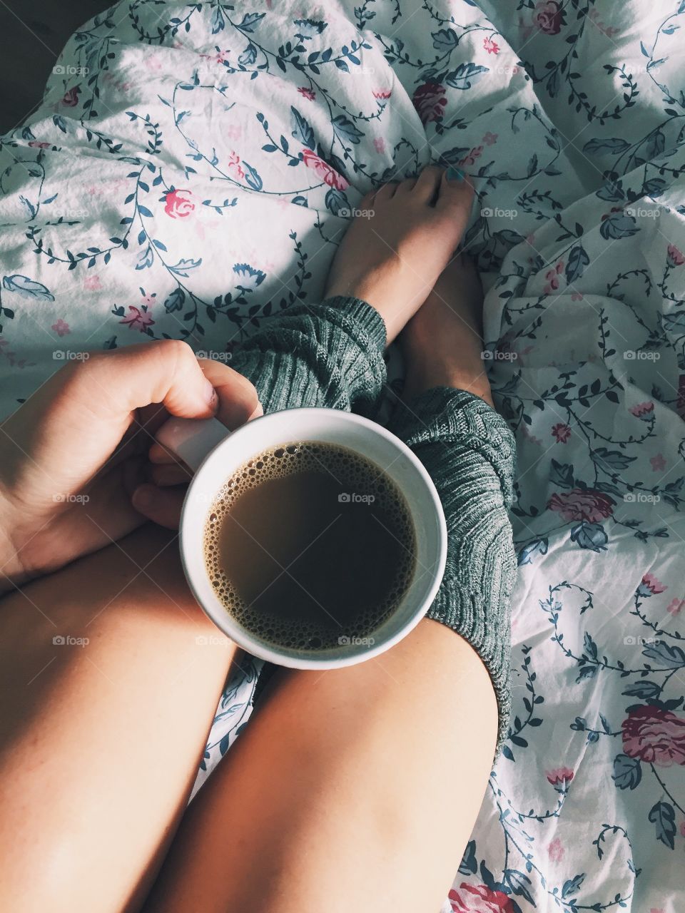 Women holding coffee cup