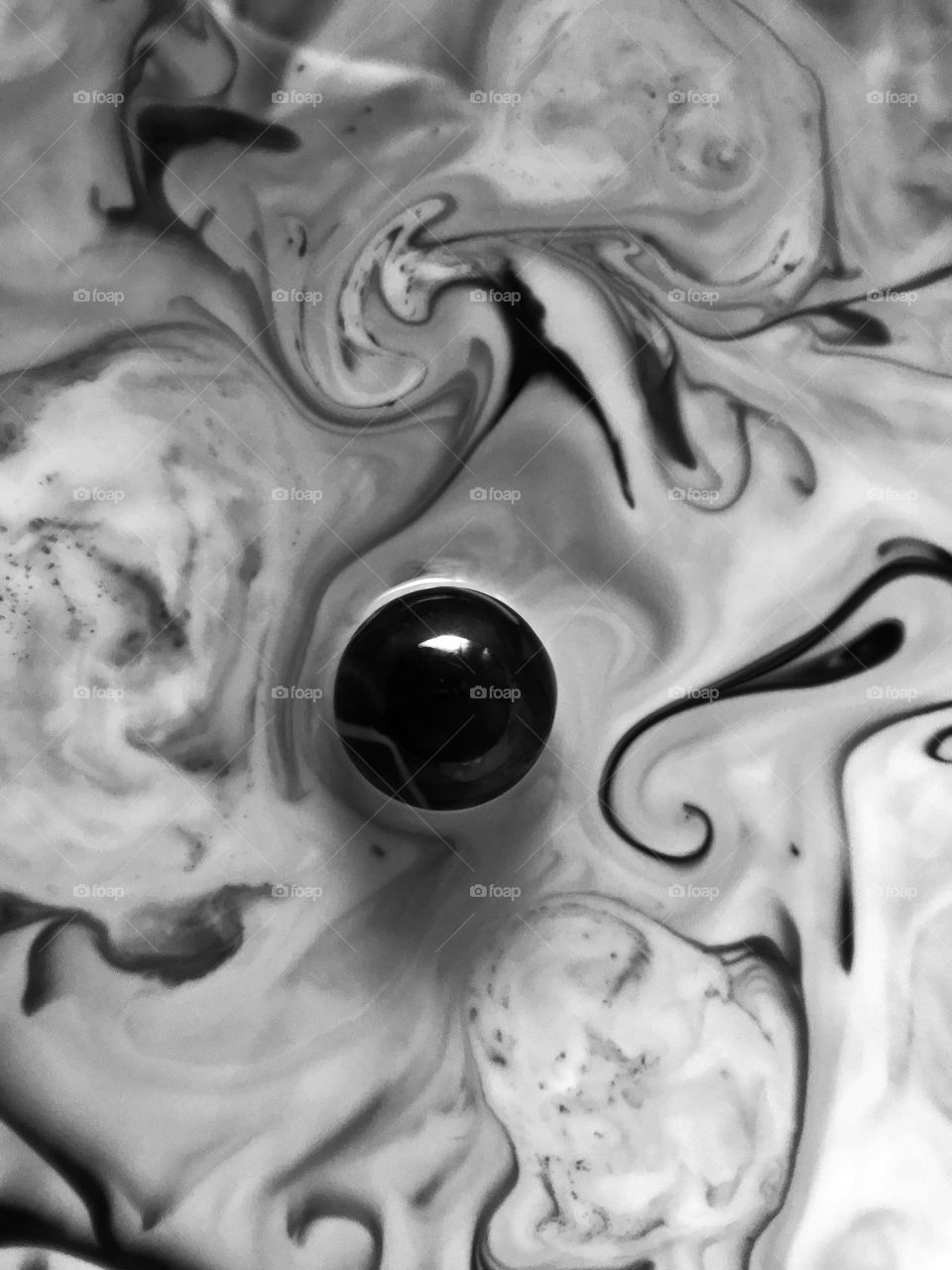 Creating soft, flowing, dynamic, three dimensional abstracts today. This black and white was made with glue and dish soap with food dye painted in small swirling lines into the mixture. All centered by one shiny dark marble.