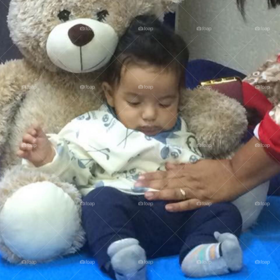 Baby Arthur playing with toys 