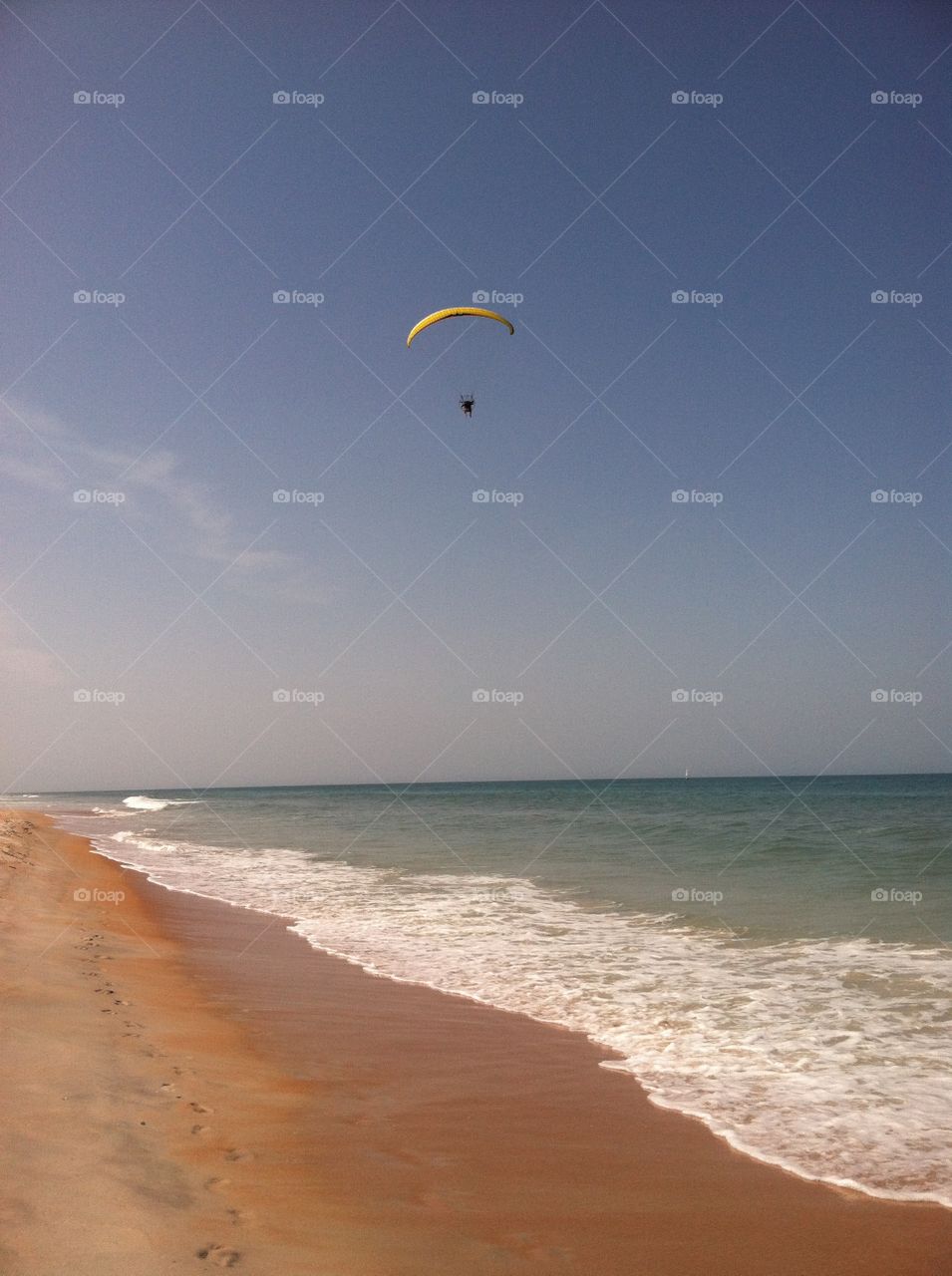 Parasailing . Watching them float through the air 