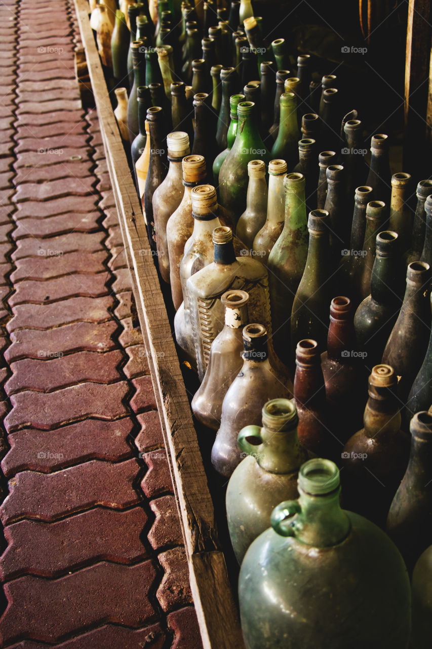 Old bottles are placed on the corridor.