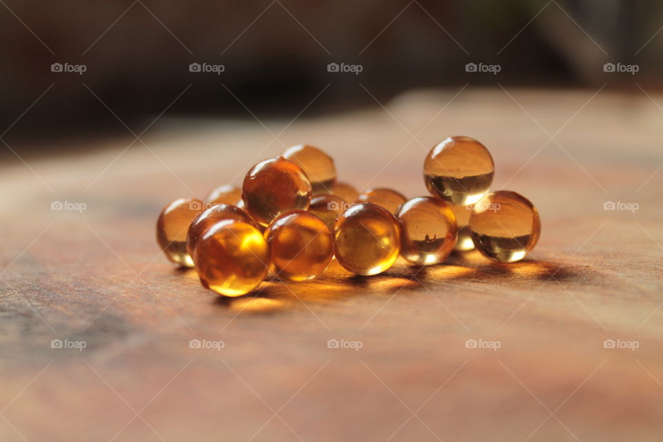 Pills, lights, ice, balls, hand, concrete, pills in hand, beautiful background, glass, round glass, glass balls, LEDs, capsules, bokeh,
