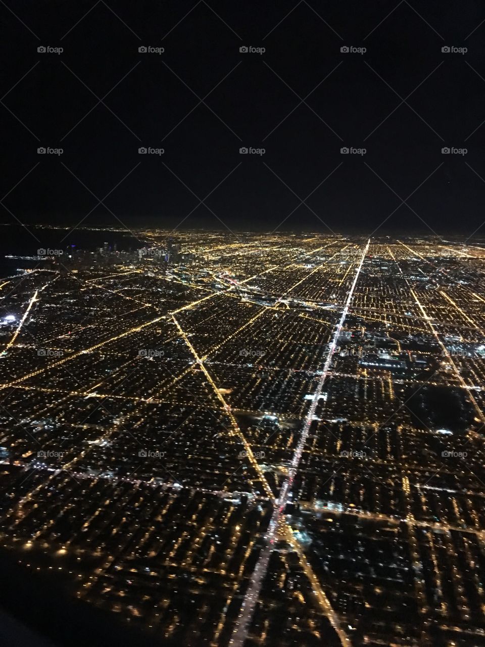 Flying into Chicago, Illinois at night
