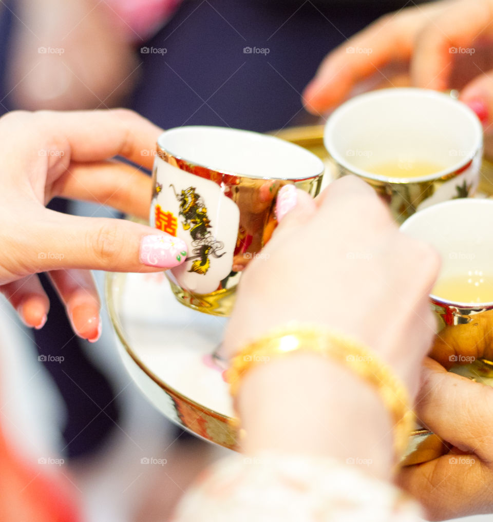 Close-up of hand holding cup