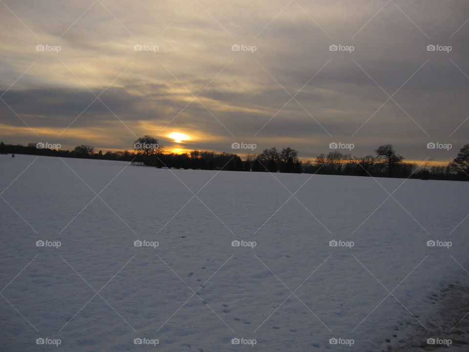 Snow Field At Sunset