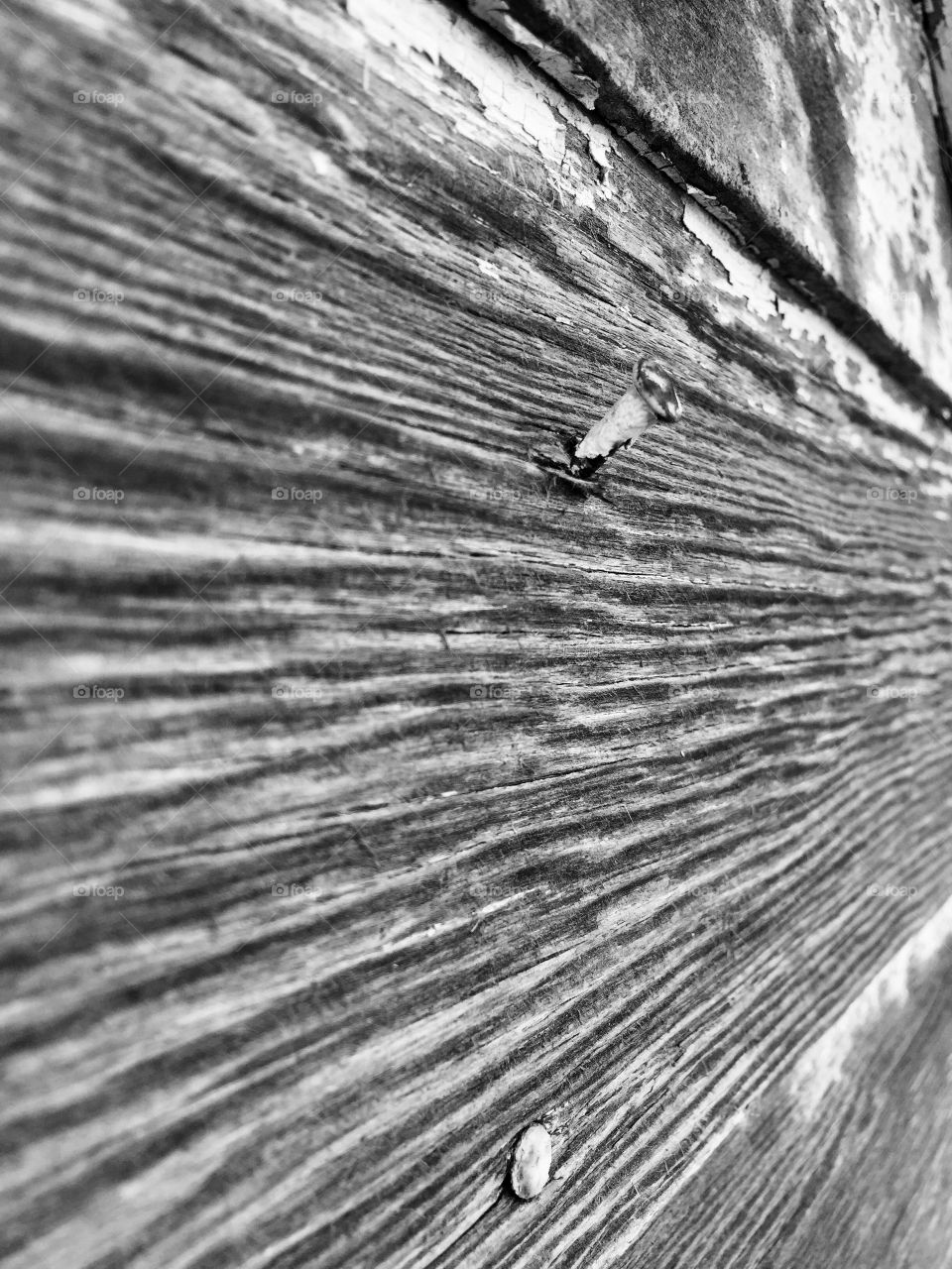 Creative Textures - wood surface with nails from an angle 