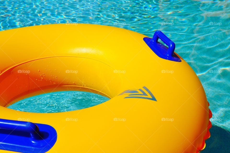 Yellow pool float.