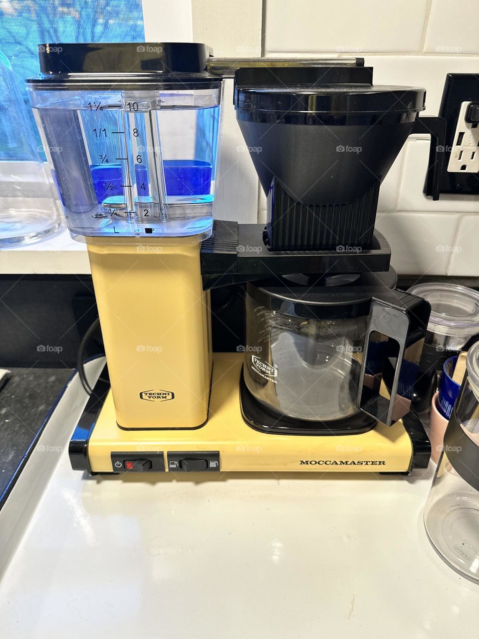 Making coffee at home, saving money by making fancy coffee at home, large coffee maker on countertop, coffee maker for hipsters