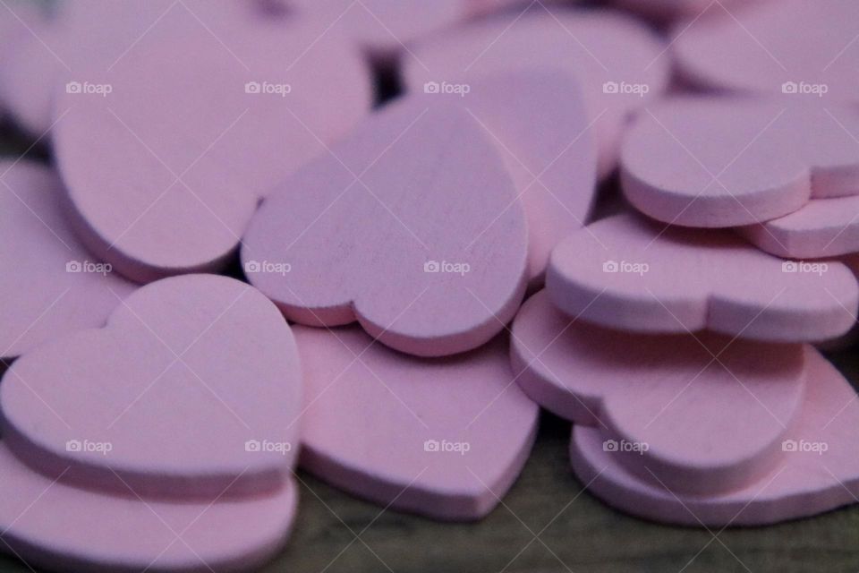 Pink wooden hearts closeup 