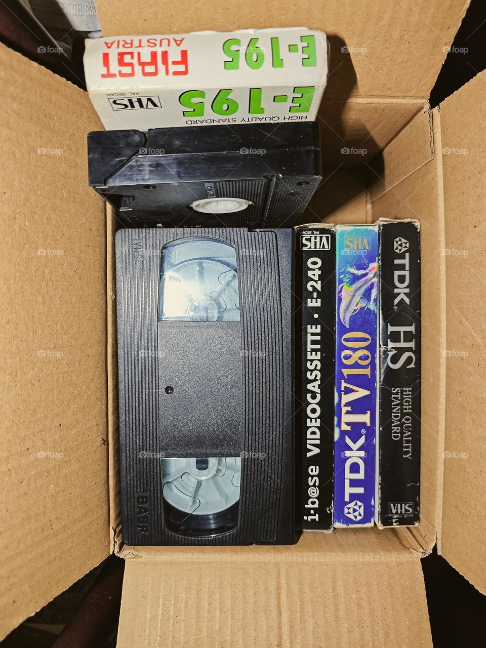 The flickering screen, the rewind button's click – memories preserved in plastic and magnetic tape.