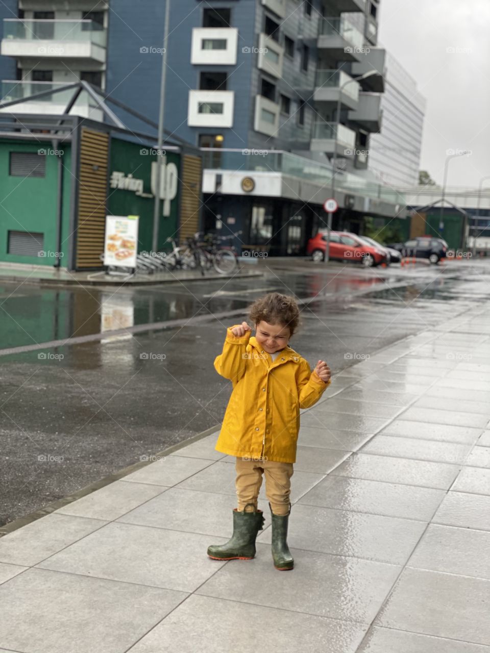 Rain, a boy and a happy boy