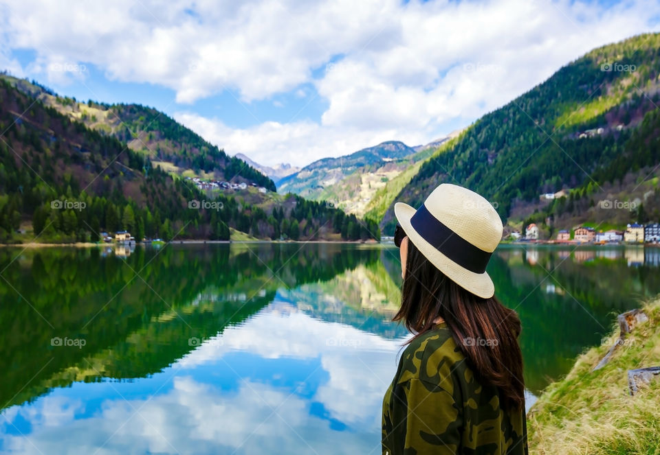 Enjoying view of lake Alleghe, Dolomites 