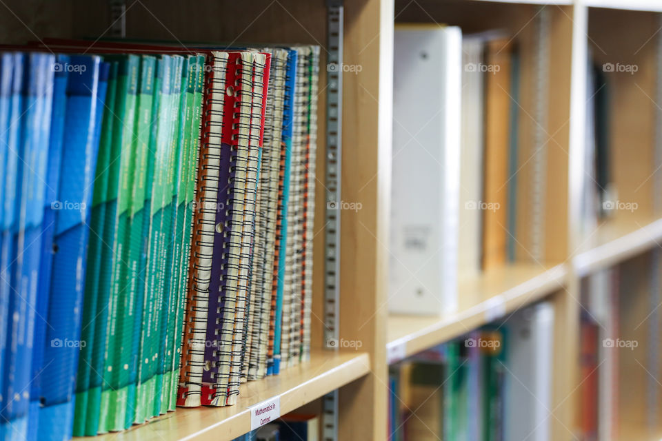 Books on a shelf in a library