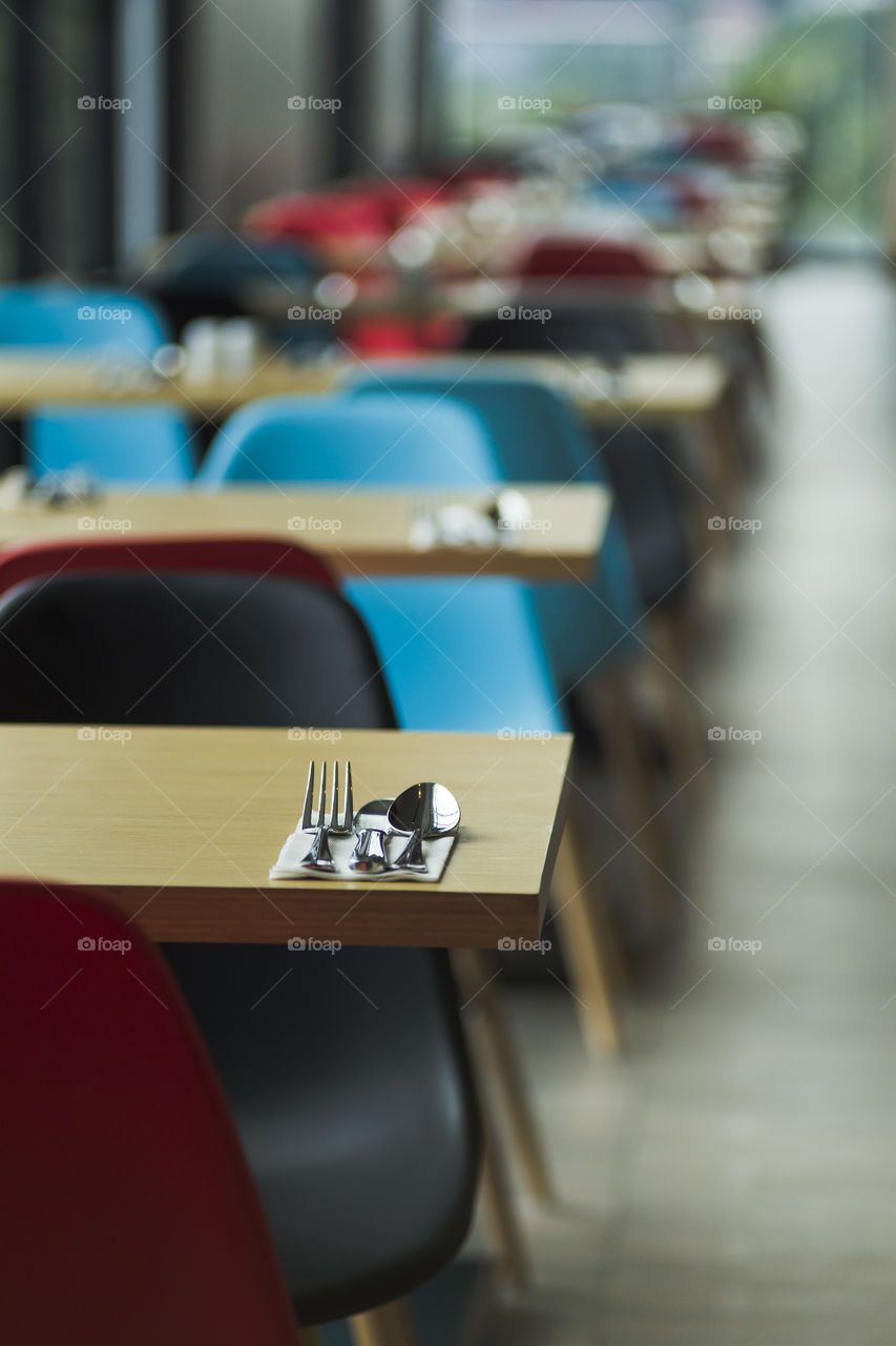selective focus close uo of a table set up in an empty restaurant