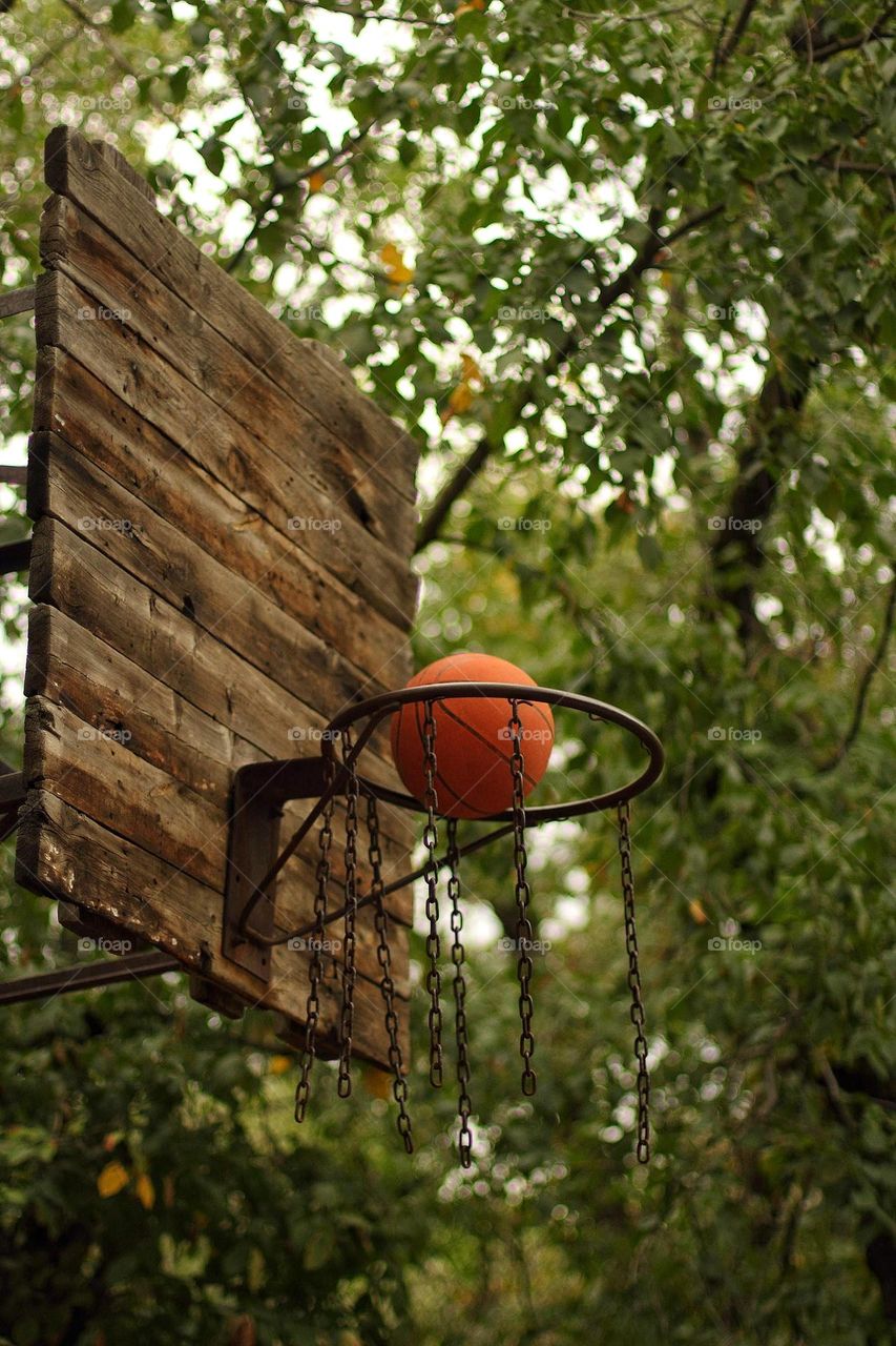 The ball flies into the basketball hoop
