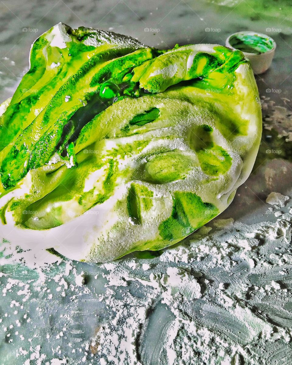 a handmade ball of sugar paste placed on a marbled worktop