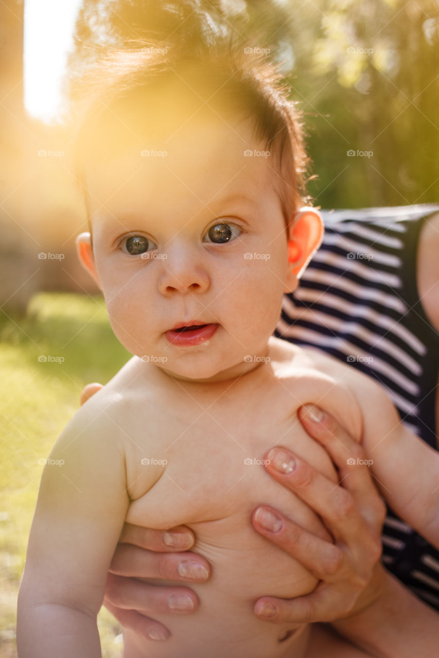 Little infant baby with mother 