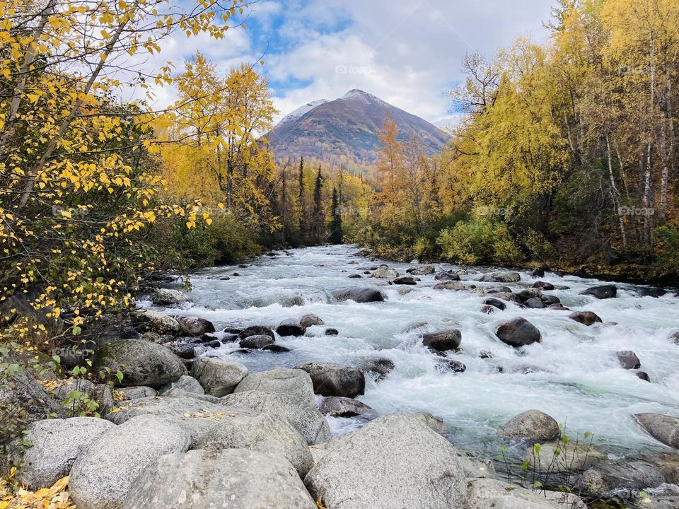 Fall in Alaska on the Little Susitna River with colorful autumn foliage and mountains 