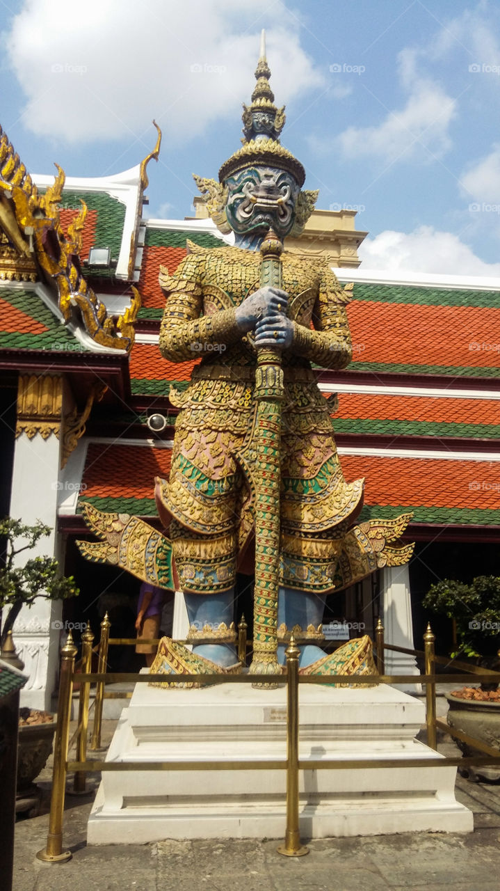 Yak Wat Phra Kaew. Guardian giant from Ramakein epic, The giant stand beside the gate to protect The Emerald Buddha (Phra Kaew Morakot). This giant named Totsakanth was king of gisnt, green colour, Have 10 faces and 20 hands
