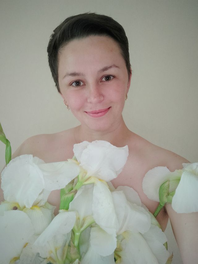 Portrait of beautiful woman with dress of flowers.