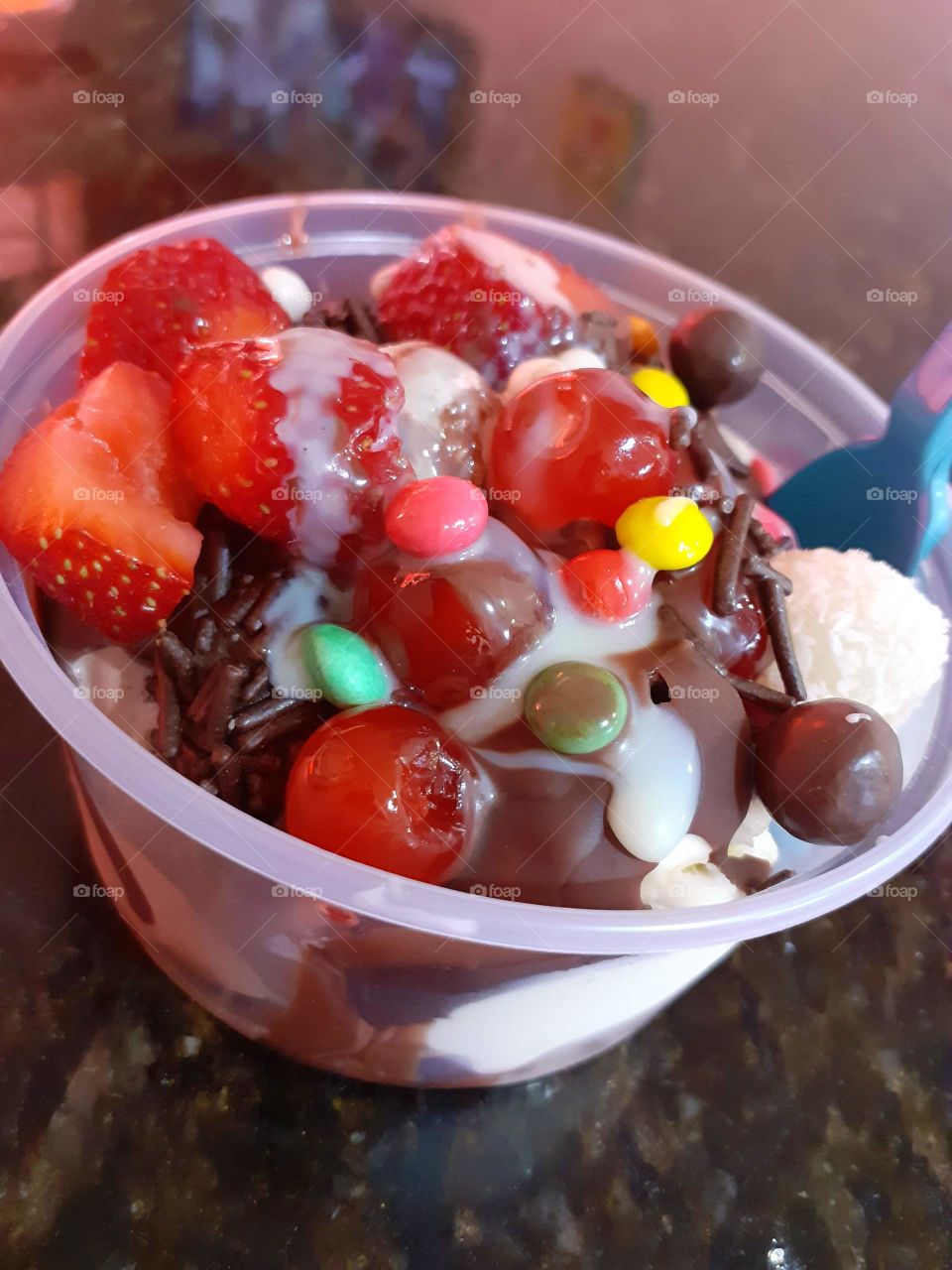 glass of ice cream with colorful mms delicious dessert