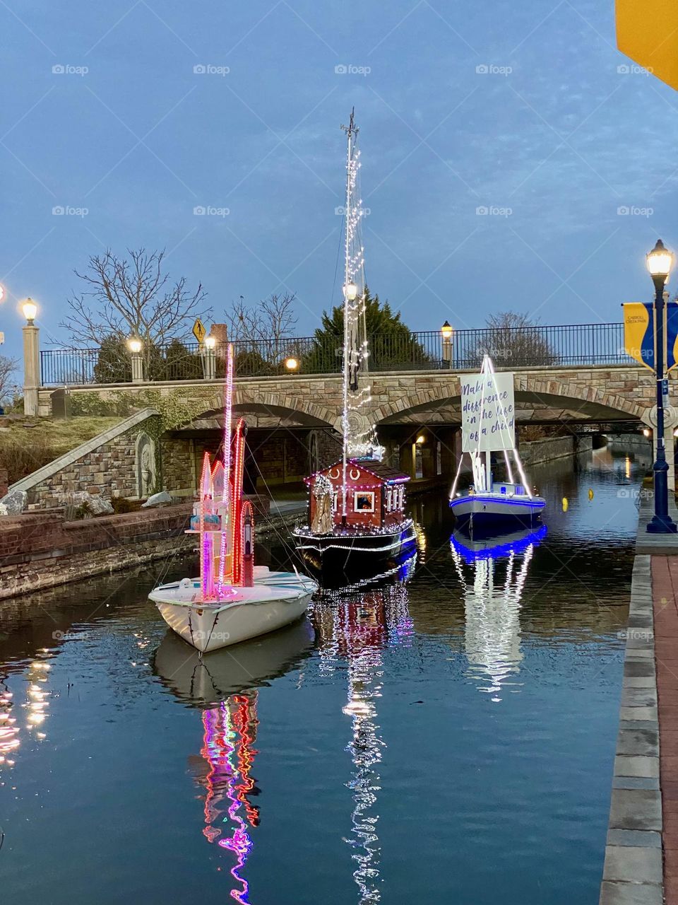 Illuminated model boats on a canal during an annual event in Frederick Maryland