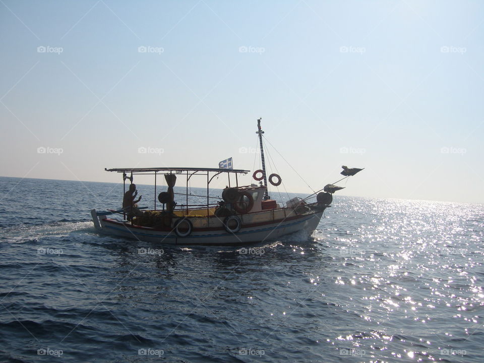 fishing boat on the horizon