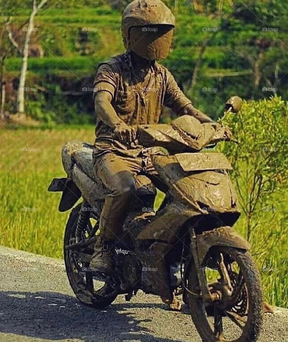 mud bath with motorcycle