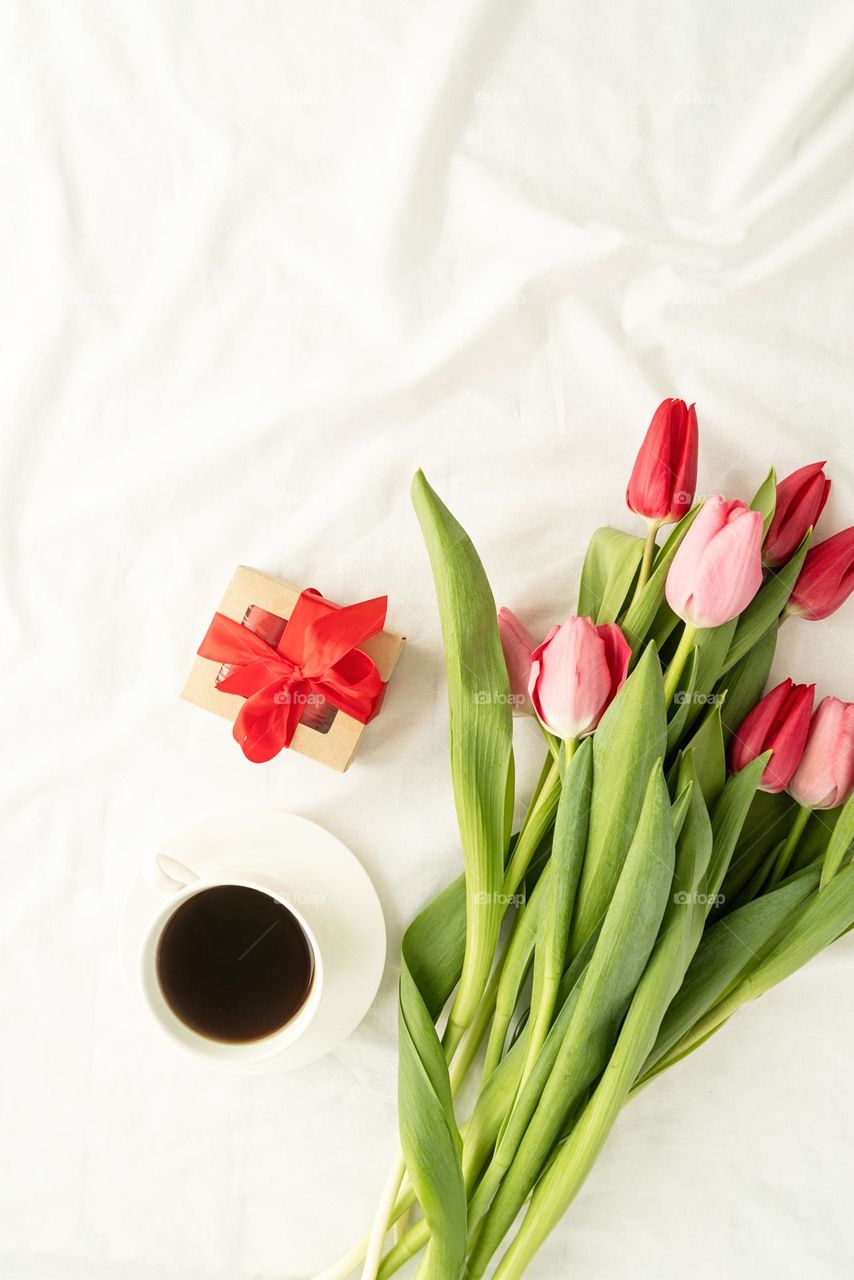 tulips and coffee in bed