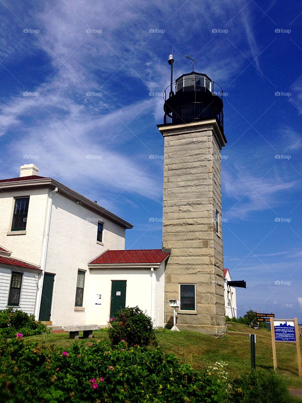 Lighthouse and building against sky