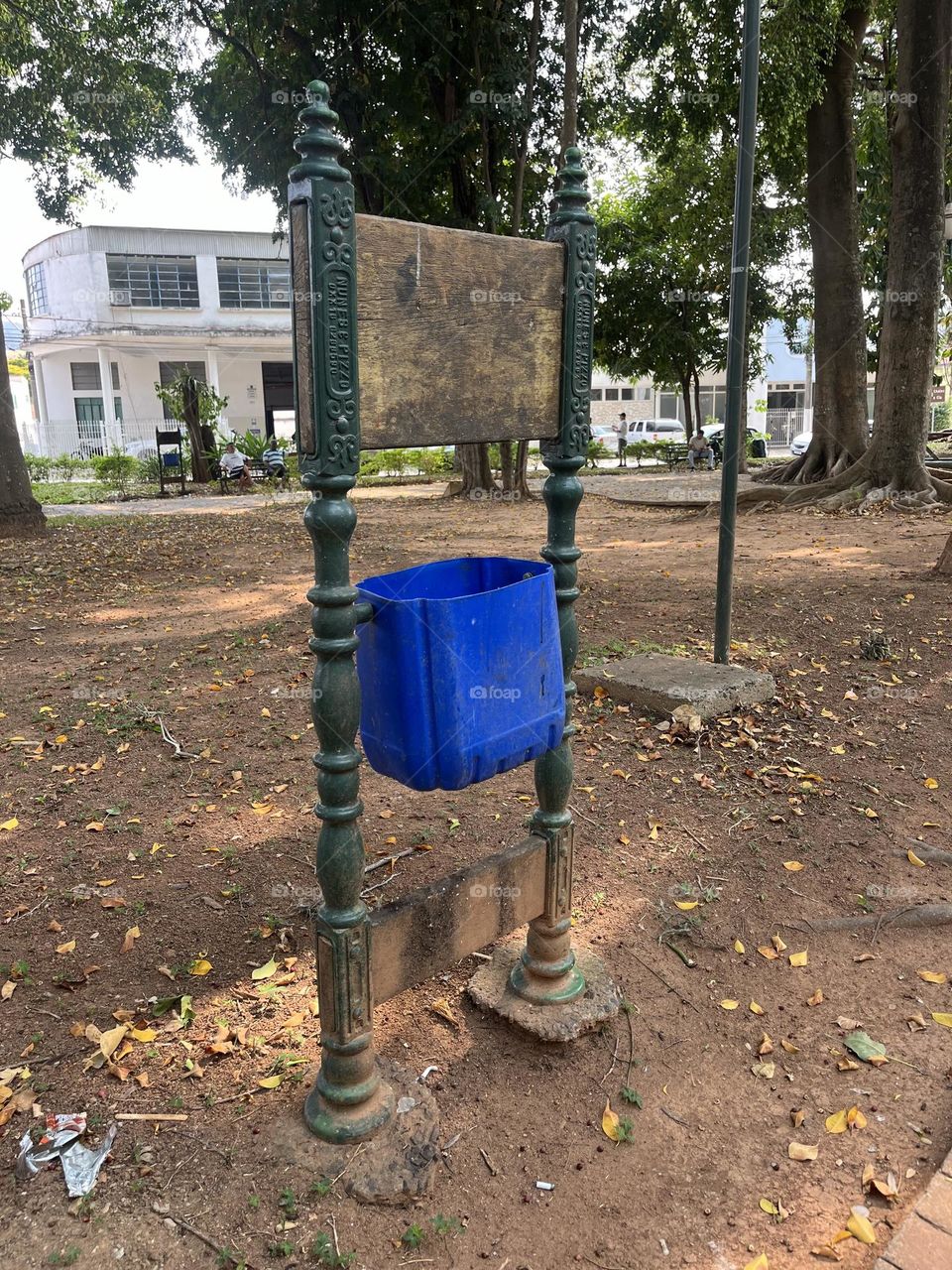 Old and new, a plastic bin in an antique metal sign