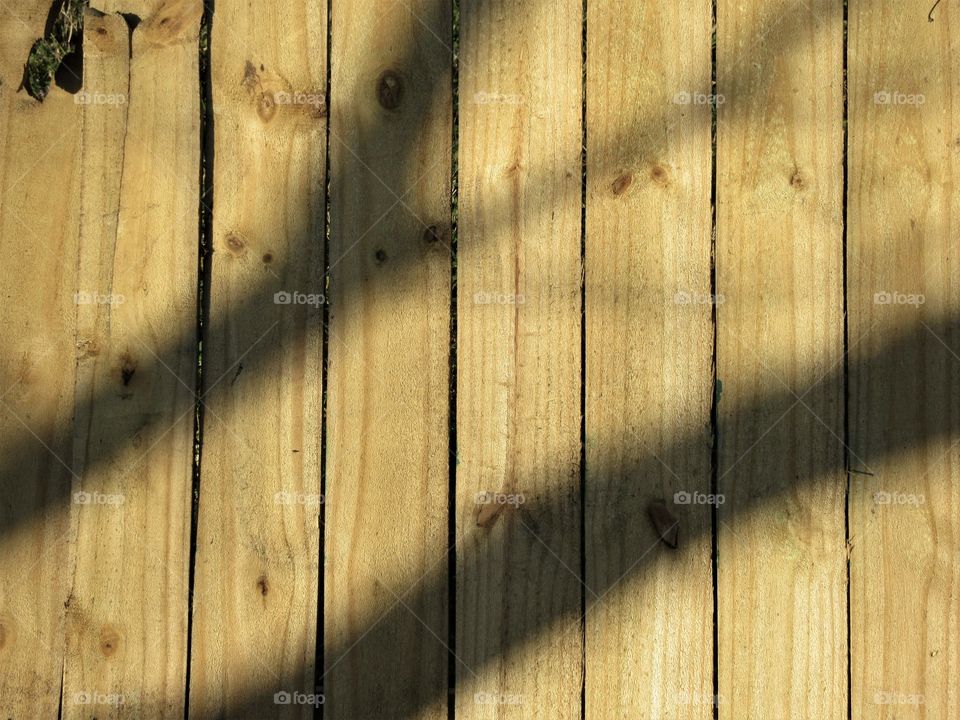 shadow on wood fence