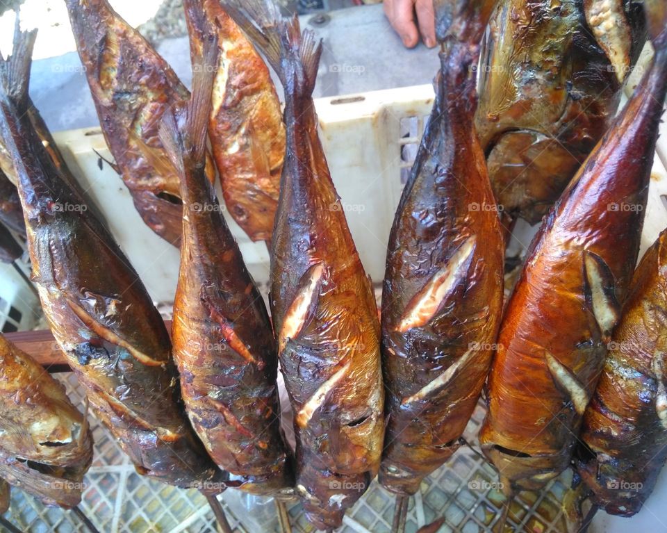 Delicious grilled fishs on beach