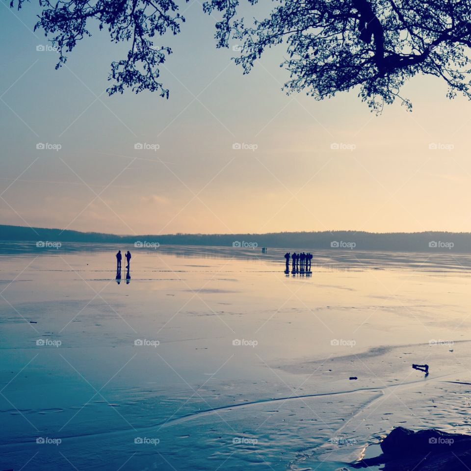 Iceskaters on lake