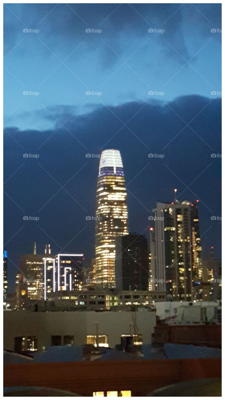 SalesForce Tower shining in the gloomy downtown skyline. Taken from Oracle Park (formerly AT&T Park, SBC Park and Pacific Bell Park).