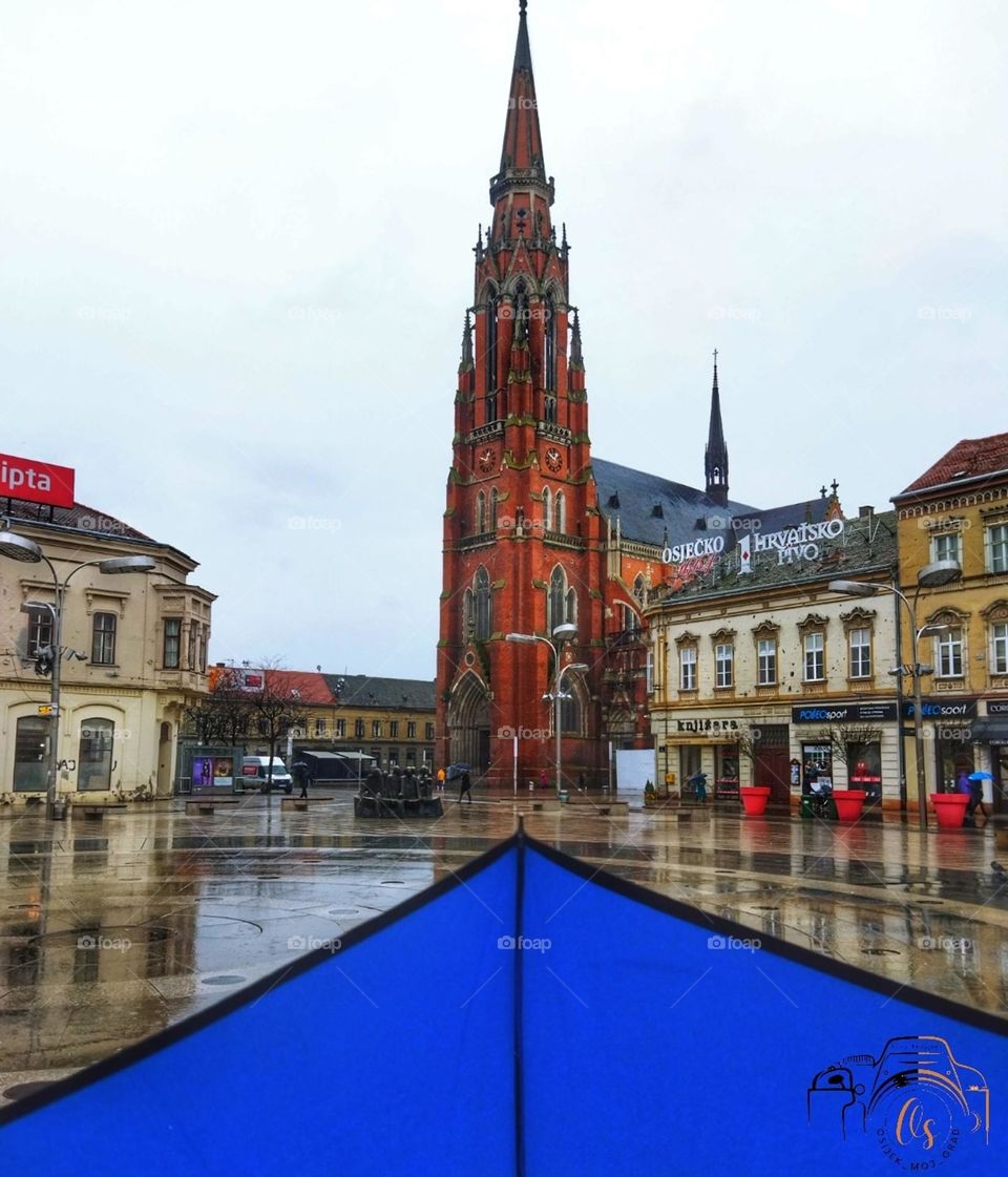 Blue umbrella in the square